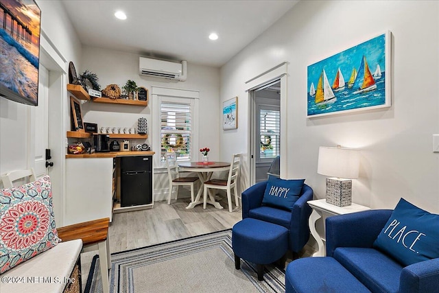 interior space featuring hardwood / wood-style flooring and a wall unit AC