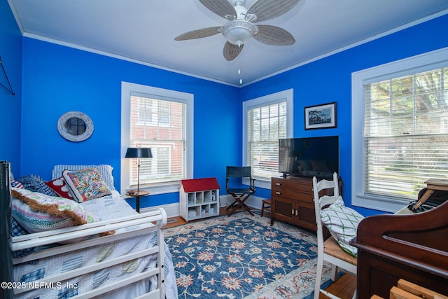 interior space featuring crown molding and ceiling fan