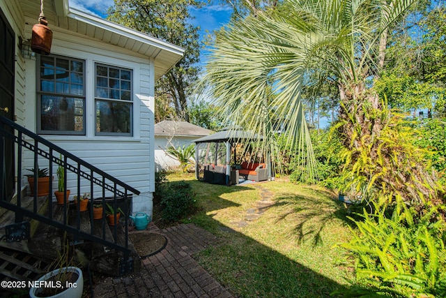 view of yard featuring an outdoor living space and a gazebo