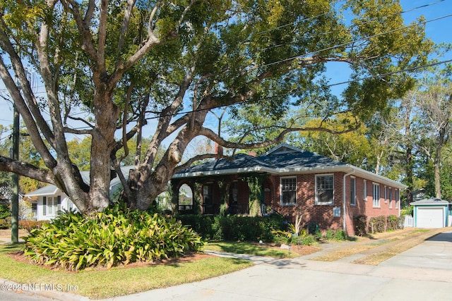 view of front of property with an outbuilding and a garage