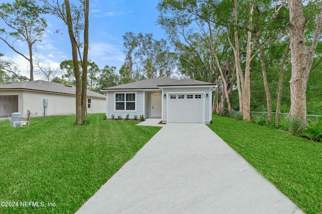 ranch-style home featuring a garage and a front lawn