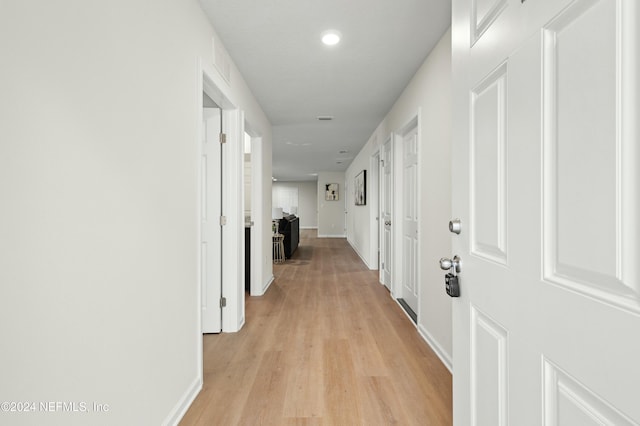 hallway featuring light hardwood / wood-style flooring