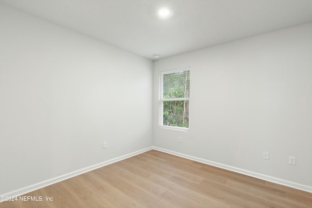 unfurnished room featuring light hardwood / wood-style floors