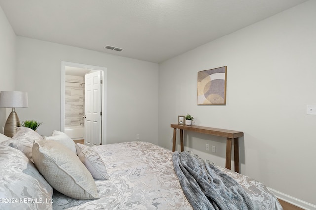 bedroom featuring connected bathroom