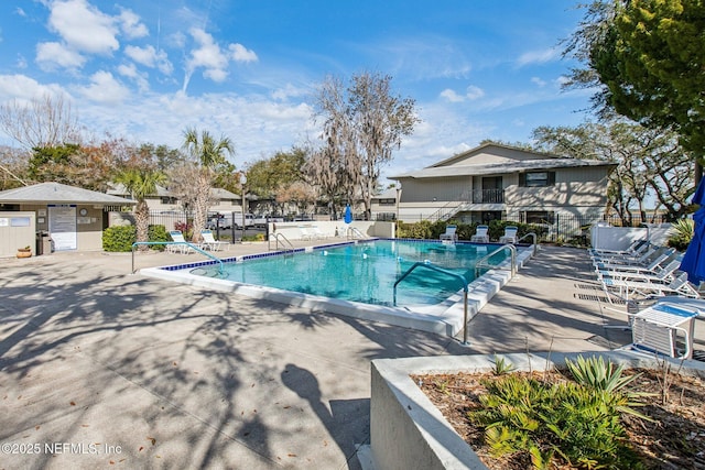 view of swimming pool with a patio area