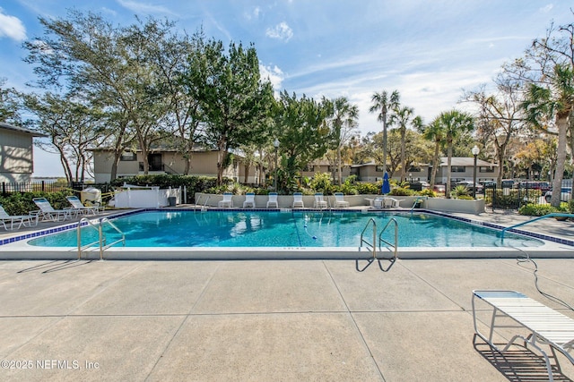 view of swimming pool featuring a patio area