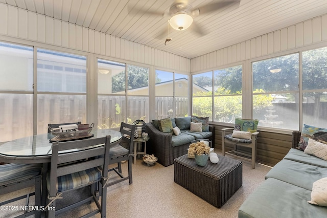 sunroom featuring ceiling fan