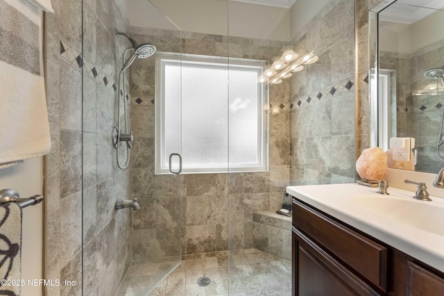 bathroom with vanity, crown molding, and a shower with shower door