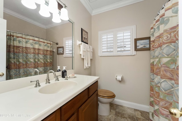 bathroom with crown molding, vanity, and toilet