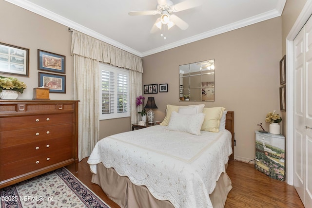 bedroom with wood-type flooring, ornamental molding, and ceiling fan