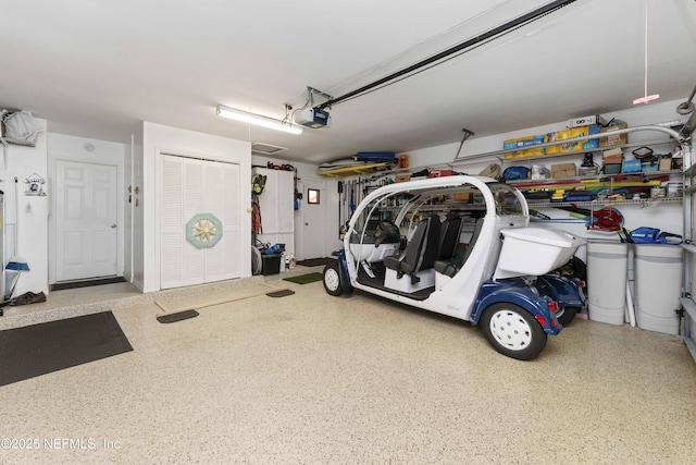 garage featuring a garage door opener