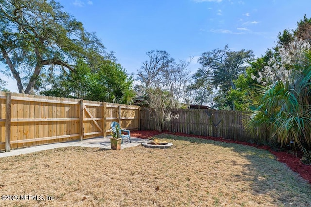 view of yard with an outdoor fire pit