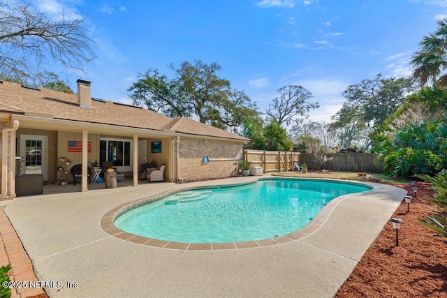 view of swimming pool featuring a patio area