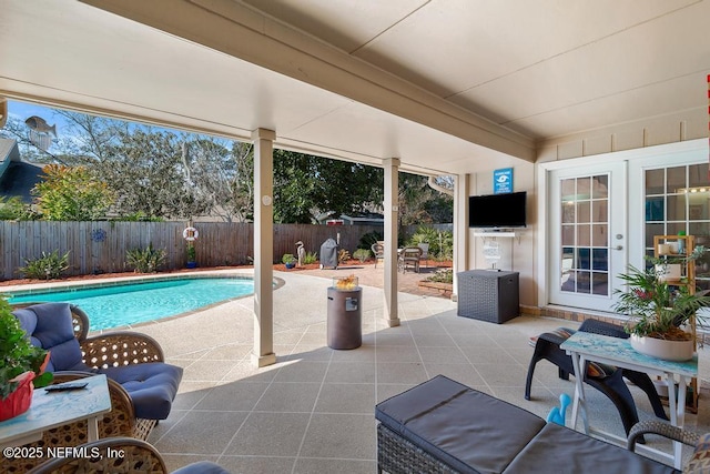 view of pool featuring french doors and a patio area