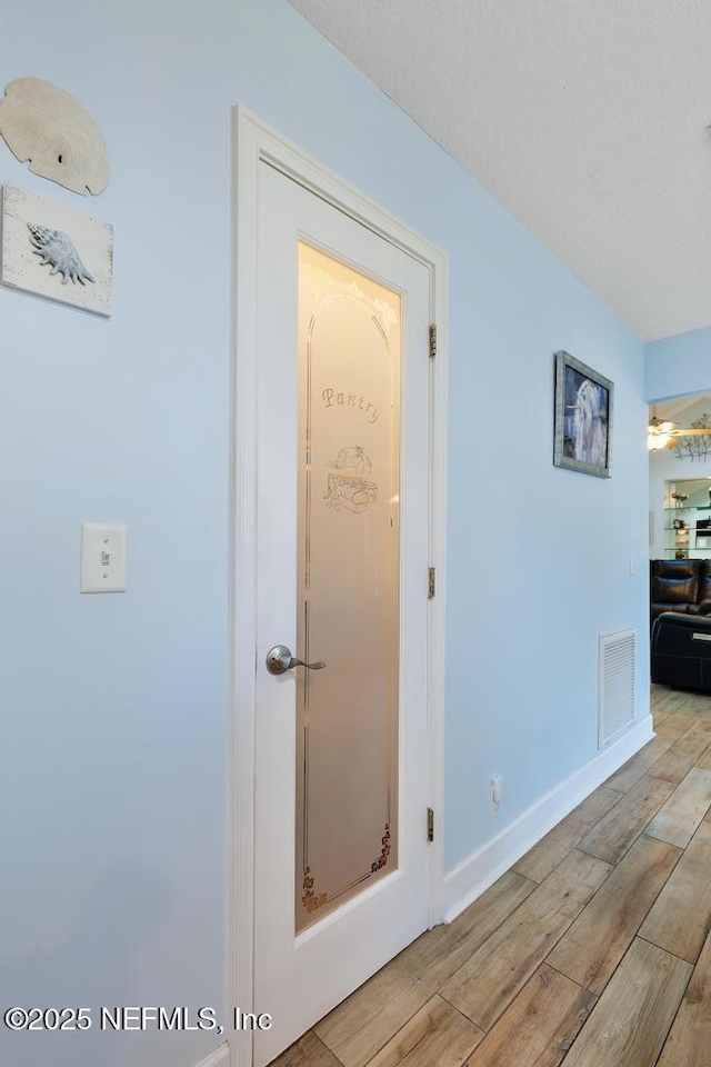 hall featuring light hardwood / wood-style floors