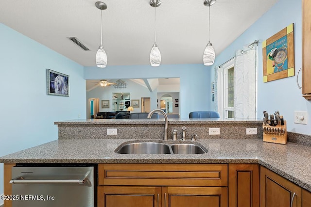 kitchen featuring sink, stainless steel dishwasher, hanging light fixtures, and ceiling fan