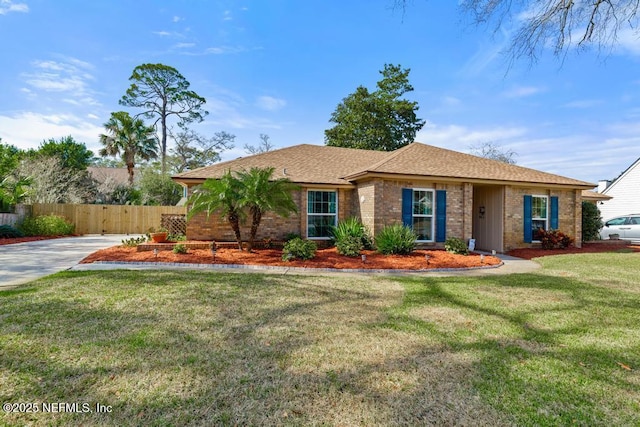 single story home featuring a front lawn