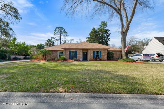 ranch-style house with a front lawn