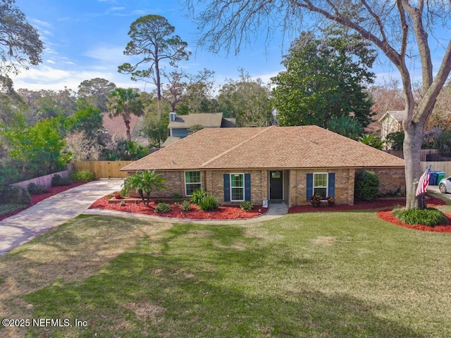 ranch-style home featuring a front yard