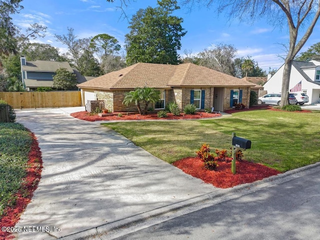 view of front facade featuring a garage and a front lawn