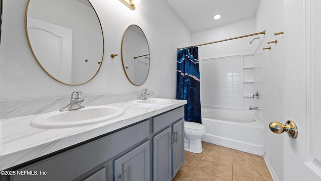 full bathroom featuring shower / tub combo with curtain, vanity, tile patterned flooring, and toilet