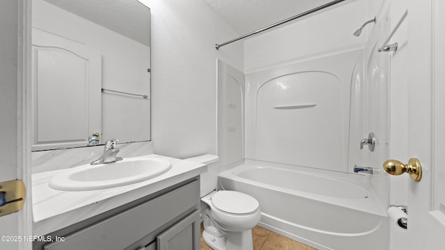 full bathroom featuring shower / bath combination, vanity, toilet, tile patterned floors, and a textured ceiling