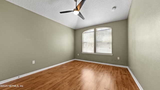 spare room featuring hardwood / wood-style floors, a textured ceiling, and ceiling fan