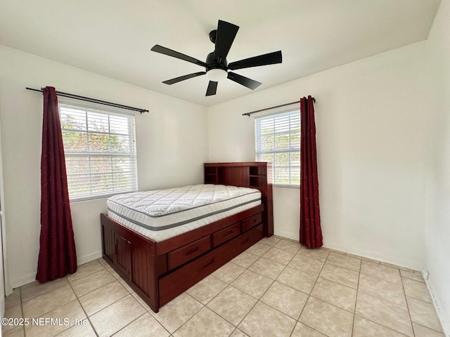 tiled bedroom with ceiling fan