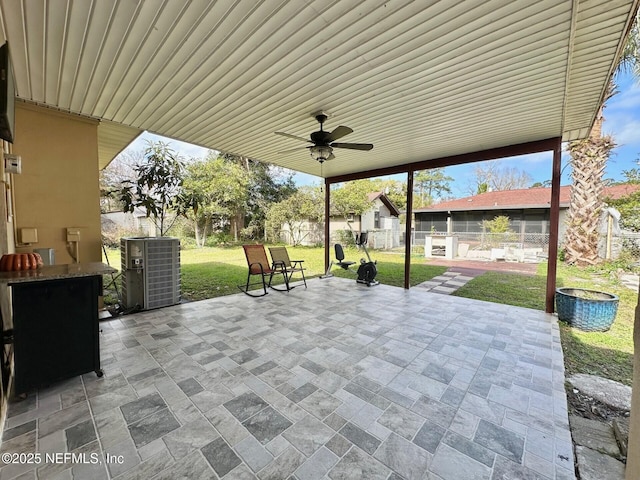 view of patio with ceiling fan and central air condition unit