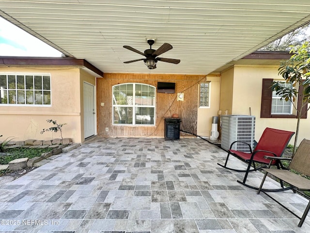 view of patio with cooling unit and ceiling fan