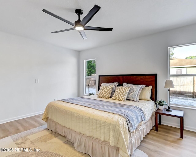 bedroom featuring ceiling fan and light wood-type flooring