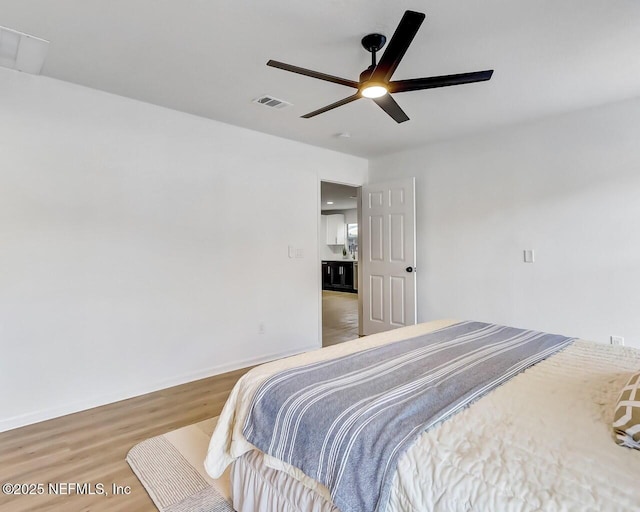 bedroom featuring ceiling fan and hardwood / wood-style floors