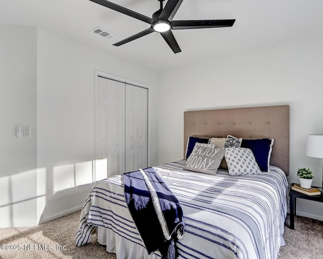 carpeted bedroom with a closet and ceiling fan