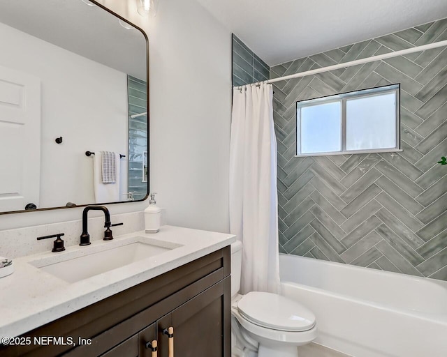 full bathroom with vanity, toilet, and shower / tub combo