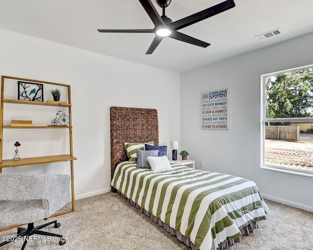 bedroom featuring light carpet and ceiling fan