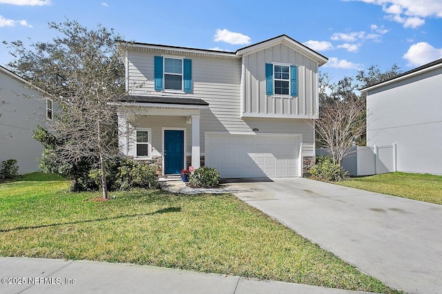 view of front of property featuring a garage, board and batten siding, and a front yard