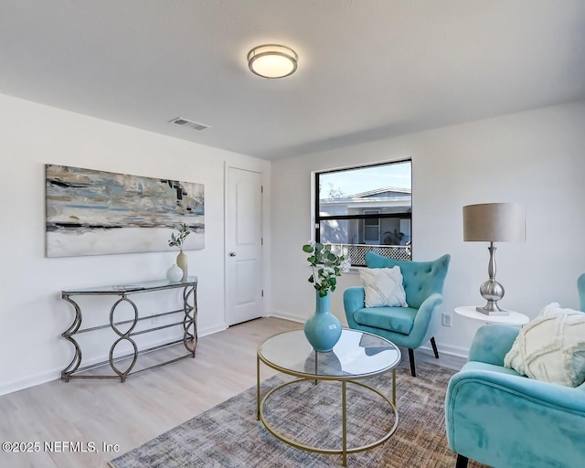 living area featuring light hardwood / wood-style floors