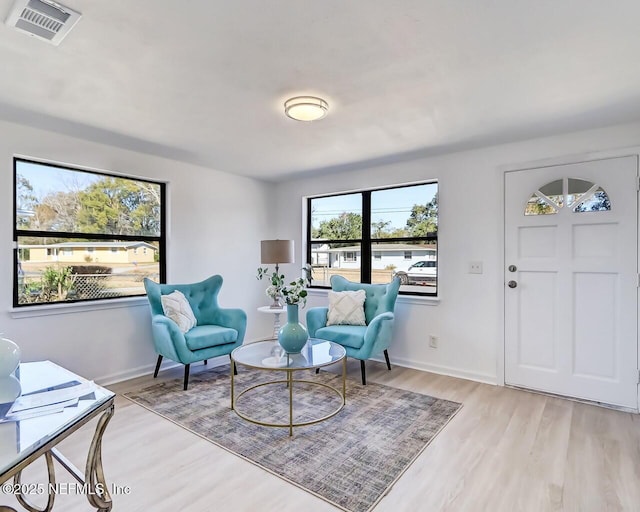 sitting room featuring light hardwood / wood-style flooring