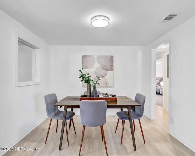 dining room featuring light wood-type flooring