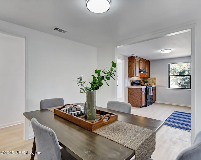 dining room featuring light hardwood / wood-style flooring