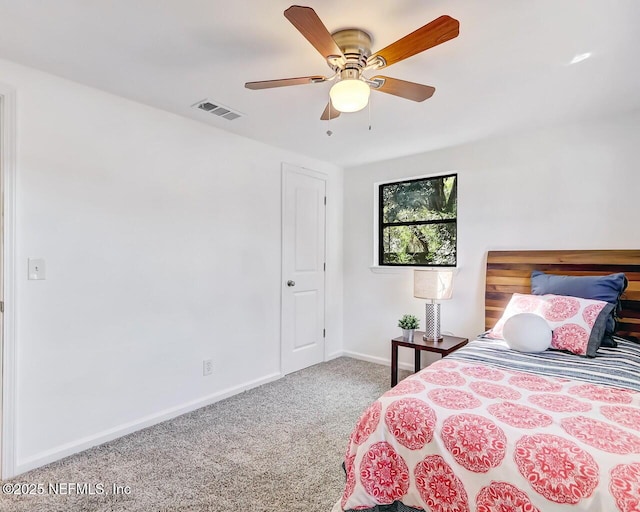 bedroom featuring ceiling fan and carpet