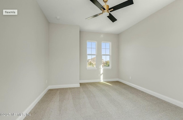 unfurnished room featuring light colored carpet and ceiling fan