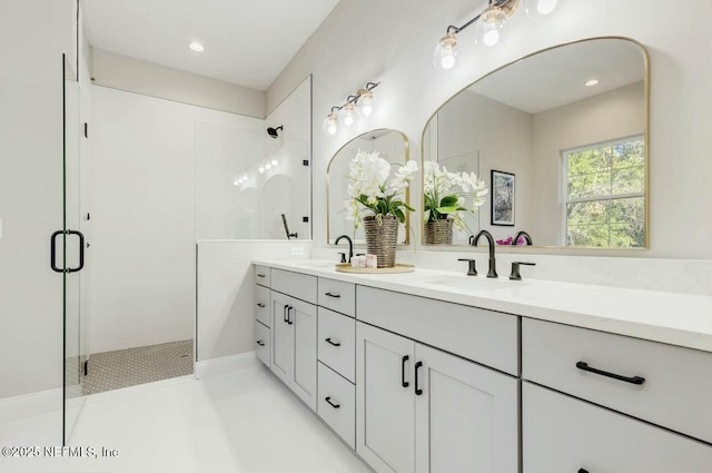 bathroom featuring vanity and tiled shower