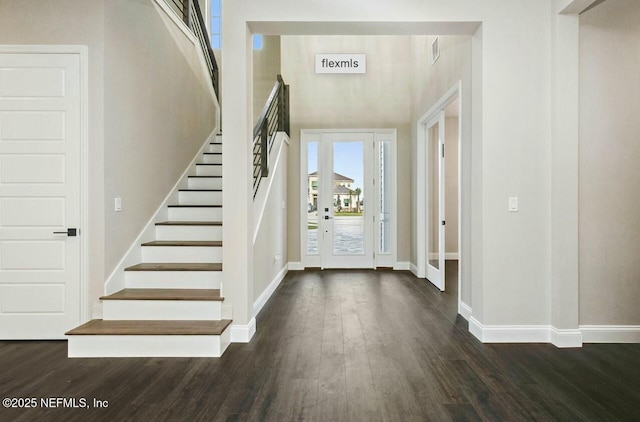 entryway with dark wood-type flooring