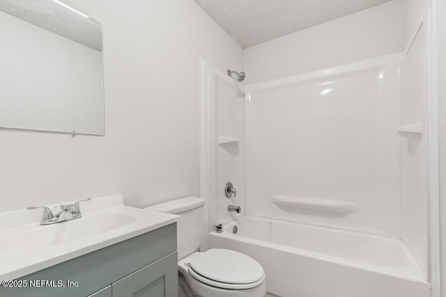 full bathroom with vanity, toilet, shower / bathing tub combination, and a textured ceiling