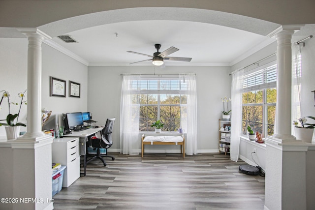 office space with crown molding, light wood-type flooring, and ornate columns