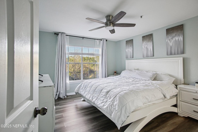 bedroom featuring dark hardwood / wood-style floors and ceiling fan