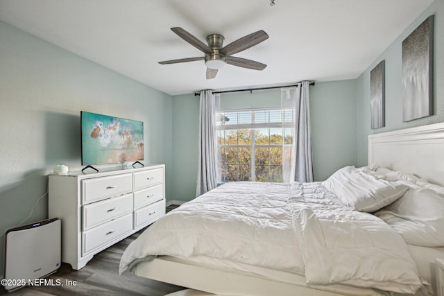 bedroom with dark wood-type flooring and ceiling fan