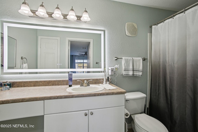 bathroom featuring vanity, toilet, and a shower with shower curtain