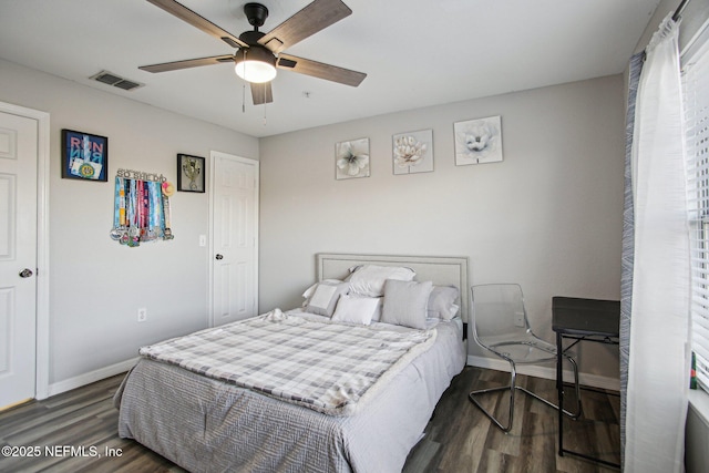 bedroom featuring ceiling fan and dark hardwood / wood-style flooring